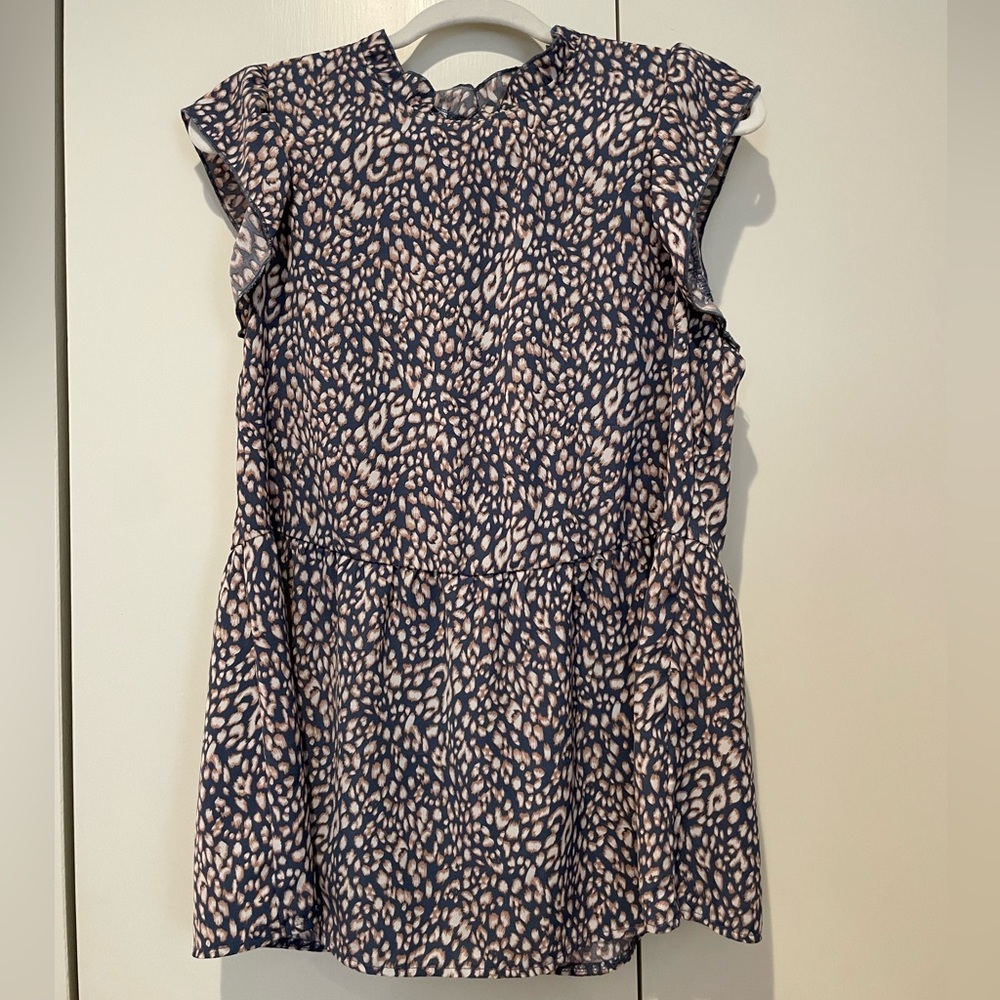 Angashion sleeveless animal print peplum blouse.